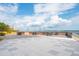 Expansive patio with tables offering scenic waterfront views and a picturesque bridge backdrop at 330 Concord St # 7E, Charleston, SC 29401