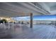 Expansive covered patio with outdoor seating and beautiful views of the waterway at 330 Concord St # 7E, Charleston, SC 29401