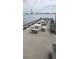 Picturesque pier with comfortable seating offering stunning waterfront views and a distant bridge backdrop at 330 Concord St # 7E, Charleston, SC 29401