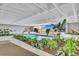 Bright indoor pool area with large windows and lush tropical plants at 330 Concord St # 7E, Charleston, SC 29401