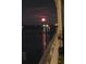 Night view overlooking a tranquil body of water, with a full moon reflecting on the surface at 330 Concord St # 7E, Charleston, SC 29401