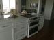 Modern kitchen features a white island with a built-in oven and sleek countertops at 330 Concord St # 9C, Charleston, SC 29401