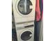 Efficient white stacked Electrolux washer and dryer, maximizing space in the laundry area at 330 Concord St # 9C, Charleston, SC 29401