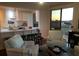 Cozy living room features hardwood floors and connects to the well lit kitchen at 330 Concord St # 9C, Charleston, SC 29401