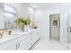 Bright bathroom with marble floors, dual sinks, and a glass-enclosed shower at 355 Claret Cup Way, Charleston, SC 29414