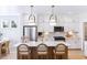 Bright and modern kitchen with white cabinetry, a large center island with seating, and stainless steel appliances at 355 Claret Cup Way, Charleston, SC 29414