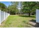 A sprawling backyard is enclosed by a crisp white fence, and offers ample green space at 3708 Colonel Vanderhorst Cir, Mount Pleasant, SC 29466