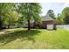 Lush backyard with a large grassy area, a wooden deck, and a privacy fence at 3708 Colonel Vanderhorst Cir, Mount Pleasant, SC 29466