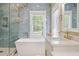 Bathroom featuring a glass shower, soaking tub, sink, and marble tile floor at 3708 Colonel Vanderhorst Cir, Mount Pleasant, SC 29466