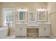Bathroom featuring dual sinks, white cabinets and square mirrors at 3708 Colonel Vanderhorst Cir, Mount Pleasant, SC 29466