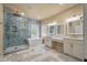 Bright bathroom featuring a glass shower, soaking tub, dual sinks, and marble tile floor at 3708 Colonel Vanderhorst Cir, Mount Pleasant, SC 29466