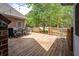 Outdoor deck features patio seating, a grill, and views of the backyard and mature trees at 3708 Colonel Vanderhorst Cir, Mount Pleasant, SC 29466