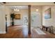 Elegant foyer featuring hardwood floors, wainscoting, and a stylish chandelier, creating a grand entrance at 3708 Colonel Vanderhorst Cir, Mount Pleasant, SC 29466