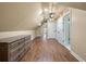 Spacious hallway with hardwood floors, ceiling fan, dresser, and doorways leading to bedrooms and bathrooms at 3708 Colonel Vanderhorst Cir, Mount Pleasant, SC 29466