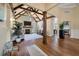 Inviting living space boasting a vaulted ceiling with wood beams, fireplace, hardwood floors, and open layout at 3708 Colonel Vanderhorst Cir, Mount Pleasant, SC 29466