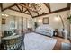 Comfortable living room featuring a vaulted ceiling with exposed beams, a plush rug, and stylish seating at 3708 Colonel Vanderhorst Cir, Mount Pleasant, SC 29466