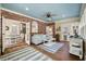 Comfortable living area with brick accent wall, blue ceiling and multiple doorways at 3708 Colonel Vanderhorst Cir, Mount Pleasant, SC 29466