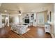 Living room featuring hardwood floors, built-in shelves, and a ceiling fan at 3708 Colonel Vanderhorst Cir, Mount Pleasant, SC 29466