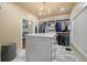 Well-organized walk-in closet with a center island, custom shelving, and neutral tones at 3708 Colonel Vanderhorst Cir, Mount Pleasant, SC 29466