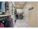 Walk-in closet with custom shelving, laundry area, and ample storage for all your wardrobe needs at 3708 Colonel Vanderhorst Cir, Mount Pleasant, SC 29466