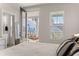 Serene bedroom with porch access and a glimpse of neighborhood homes at 384 Ripple Park Dr, Summerville, SC 29486