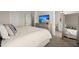 Bright bedroom with a TV, a comfortable bed, and view into bathroom at 384 Ripple Park Dr, Summerville, SC 29486