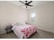 Bright bedroom featuring a ceiling fan, a window, and cozy carpet at 384 Ripple Park Dr, Summerville, SC 29486