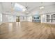 Large, open room with high ceilings and luxury vinyl plank flooring perfect for entertaining at 384 Ripple Park Dr, Summerville, SC 29486