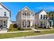 Charming two-story home featuring a double front porch, well-manicured lawn, and inviting curb appeal at 384 Ripple Park Dr, Summerville, SC 29486