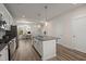 Bright kitchen with stainless appliances and granite countertops, connecting to a home office with a desk near a window at 384 Ripple Park Dr, Summerville, SC 29486