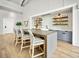 Kitchenette area with bar seating, geometric backsplash and decorative shelving in the clubhouse at 384 Ripple Park Dr, Summerville, SC 29486