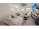 Cozy living area featuring a stylish ceiling fan, hardwood floors, flat-screen TV, and comfortable seating at 384 Ripple Park Dr, Summerville, SC 29486