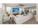 Inviting living room featuring hardwood floors, a flat-screen television, and comfortable seating arrangements at 384 Ripple Park Dr, Summerville, SC 29486