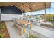 Covered outdoor seating area with picnic tables and barstool seating, perfect for community gatherings at 384 Ripple Park Dr, Summerville, SC 29486
