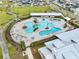 Aerial view showcases a winding pool with ample seating in a vibrant community at 384 Ripple Park Dr, Summerville, SC 29486