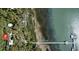 Aerial view showcases waterfront, dock, shoreline and lush foliage, offering a sense of privacy at 4113 Buccaneer Rd, Isle of Palms, SC 29451