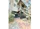 Exterior of home featuring lush landscaping, a red brick path, and stairs to a covered deck at 4113 Buccaneer Rd, Isle of Palms, SC 29451