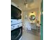 Cozy bathroom features a stacked washer and dryer and stylish fixtures at 4113 Buccaneer Rd, Isle of Palms, SC 29451