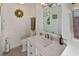 Bright bathroom with white cabinets, quartz countertop, and modern fixtures at 4113 Buccaneer Rd, Isle of Palms, SC 29451