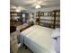 View of the bedroom with a large bed, wooden shelves and access to the outside at 4113 Buccaneer Rd, Isle of Palms, SC 29451