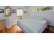 Serene bedroom with hardwood floors, natural light, and a relaxing atmosphere at 4113 Buccaneer Rd, Isle of Palms, SC 29451