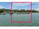 Dock featuring boat slips and access to open water, framed by vibrant pink line at 4113 Buccaneer Rd, Isle of Palms, SC 29451