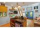 Cozy kitchen featuring an island, stainless steel appliances, unique lighting and natural light at 4113 Buccaneer Rd, Isle of Palms, SC 29451