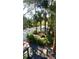 Beautiful outdoor patio with lush landscaping, mature trees, and ample seating at 4113 Buccaneer Rd, Isle of Palms, SC 29451
