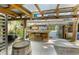 A covered outdoor bar and entertainment area features a grill and barrel table at 4113 Buccaneer Rd, Isle of Palms, SC 29451