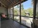 Relaxing screened porch with comfortable seating and views of the outdoors at 4113 Buccaneer Rd, Isle of Palms, SC 29451