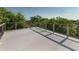 Expansive rooftop deck offering scenic views surrounded by trees and clear skies at 4113 Buccaneer Rd, Isle of Palms, SC 29451