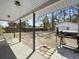 Spacious covered patio with outdoor grill and view of the detached garage at 4701 Ivydale Dr, North Charleston, SC 29405