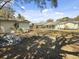 Expansive backyard featuring a detached building and partial view of neighborhood houses at 4701 Ivydale Dr, North Charleston, SC 29405