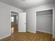Empty bedroom showcasing neutral walls, hardwood floors, and a closet at 4701 Ivydale Dr, North Charleston, SC 29405